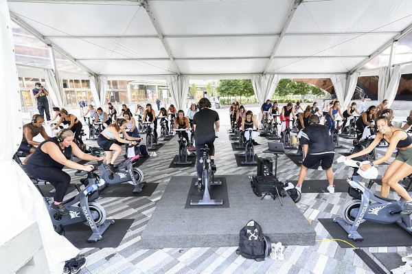 NEW YORK, NEW YORK - SEPTEMBER 04: People attend an outdoor SoulCycle class at the Hudson Yards as the city continues Phase 4 of re-opening following restrictions imposed to slow the spread of coronavirus on September 4, 2020 in New York City. The fourth phase allows outdoor arts and entertainment, sporting events without fans and media production. (Photo by Noam Galai/Getty Images)